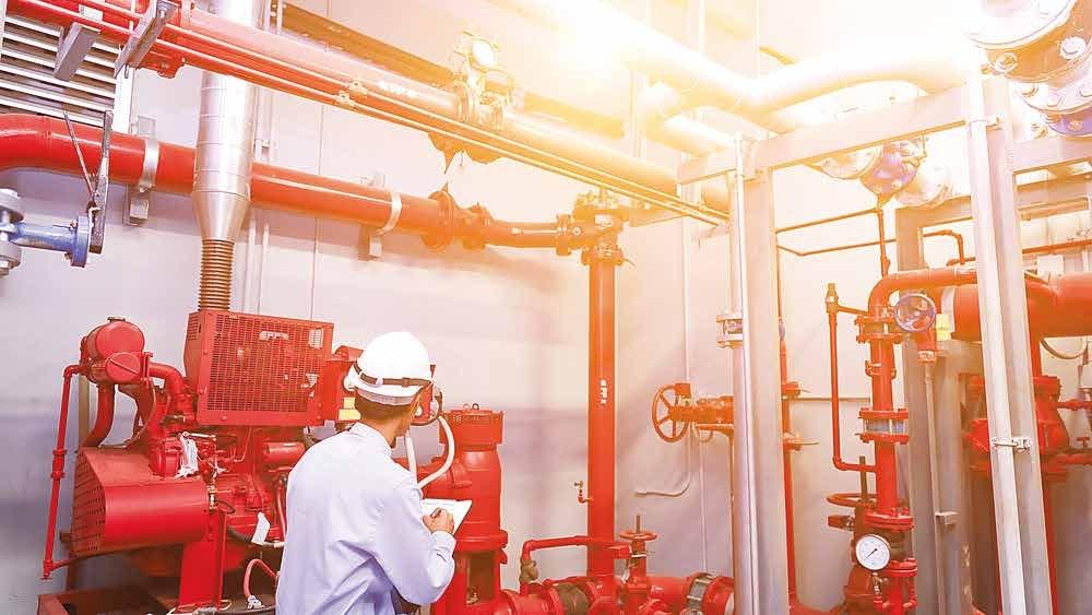 Engineer inspecting a fire pump room